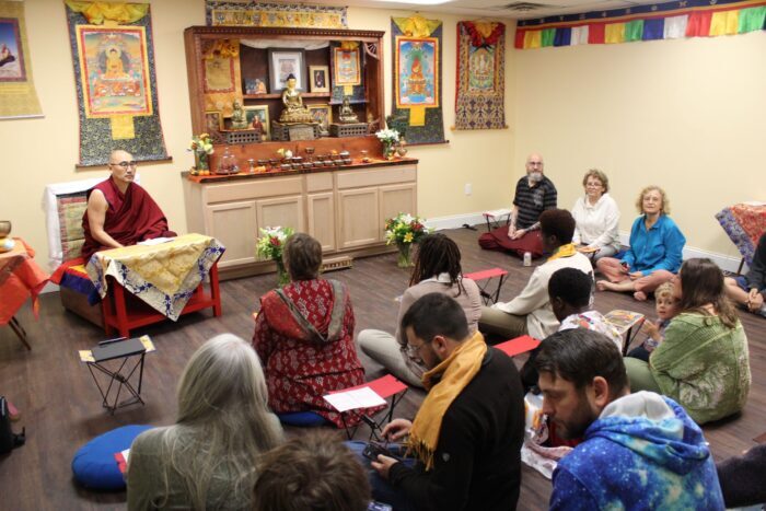 Rinpoche leading our dharma community in prayers at the new shrine room